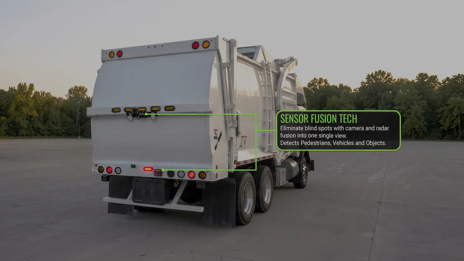 Rear of a waste truck with its camera and radar sensors marked: sensor fusion technology combines them into one single view that detects pedestrians, vehicles, and objects.