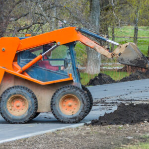 A skid-steer operating in a construction site