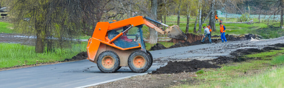 A skid-steer operating in a construction site