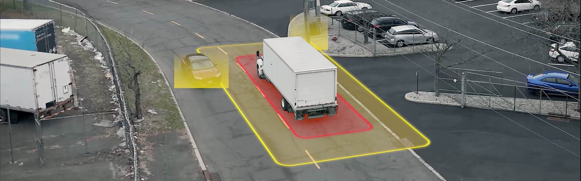 Truck driving on the road with sensor zones around it detecting an object and vehicle