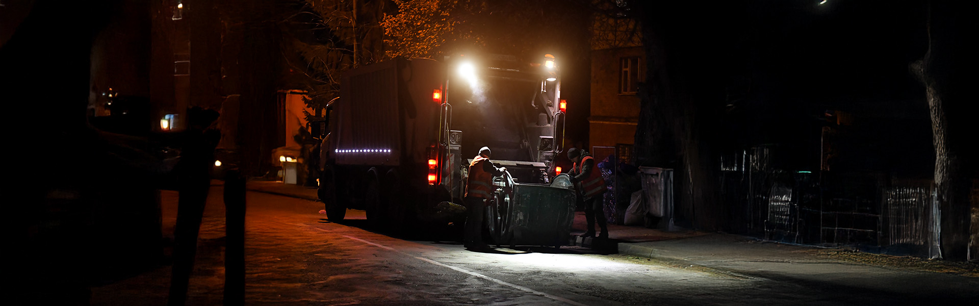 Garbage truck working in low visibility conditions